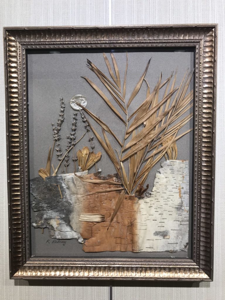 A framed piece of art.