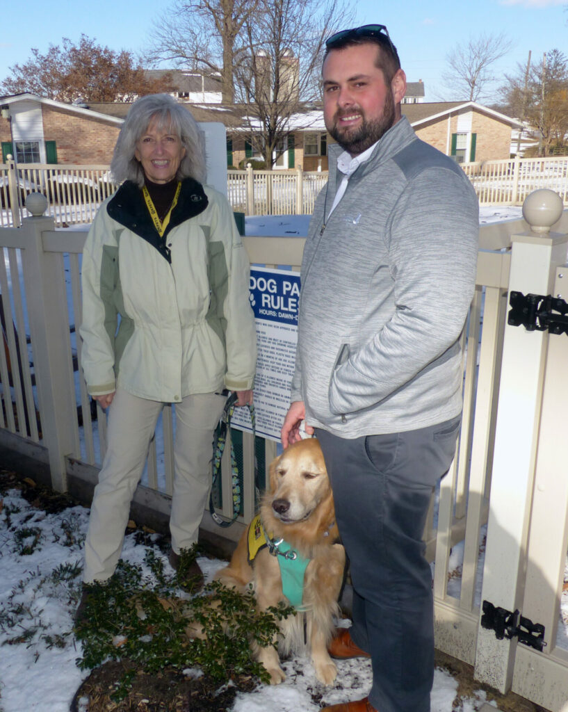 KPETS founder Karen Gerth and her dog Kody, along with Landis Homes Director of Campus Services Adam Gardner.
